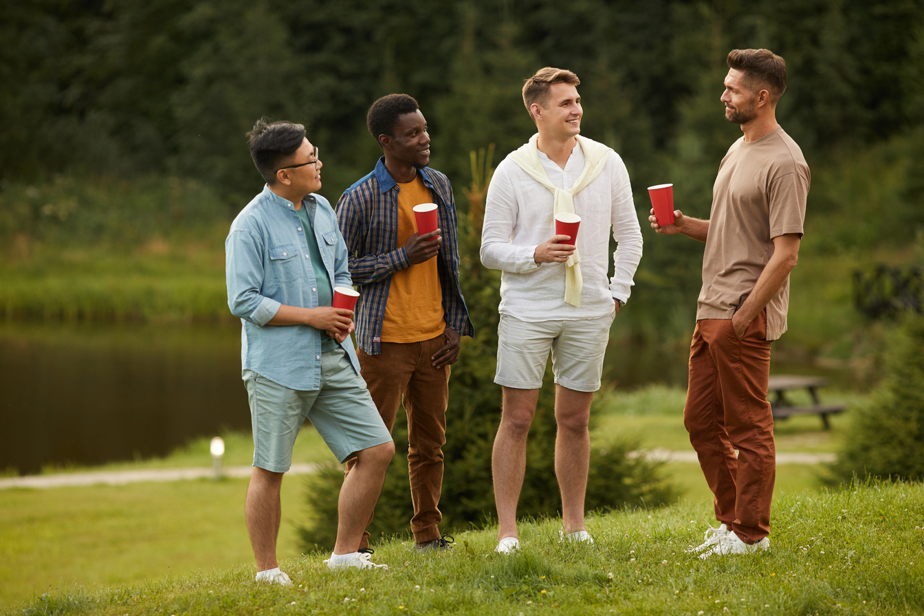 Diverse Group of Guys Chatting Outdoors